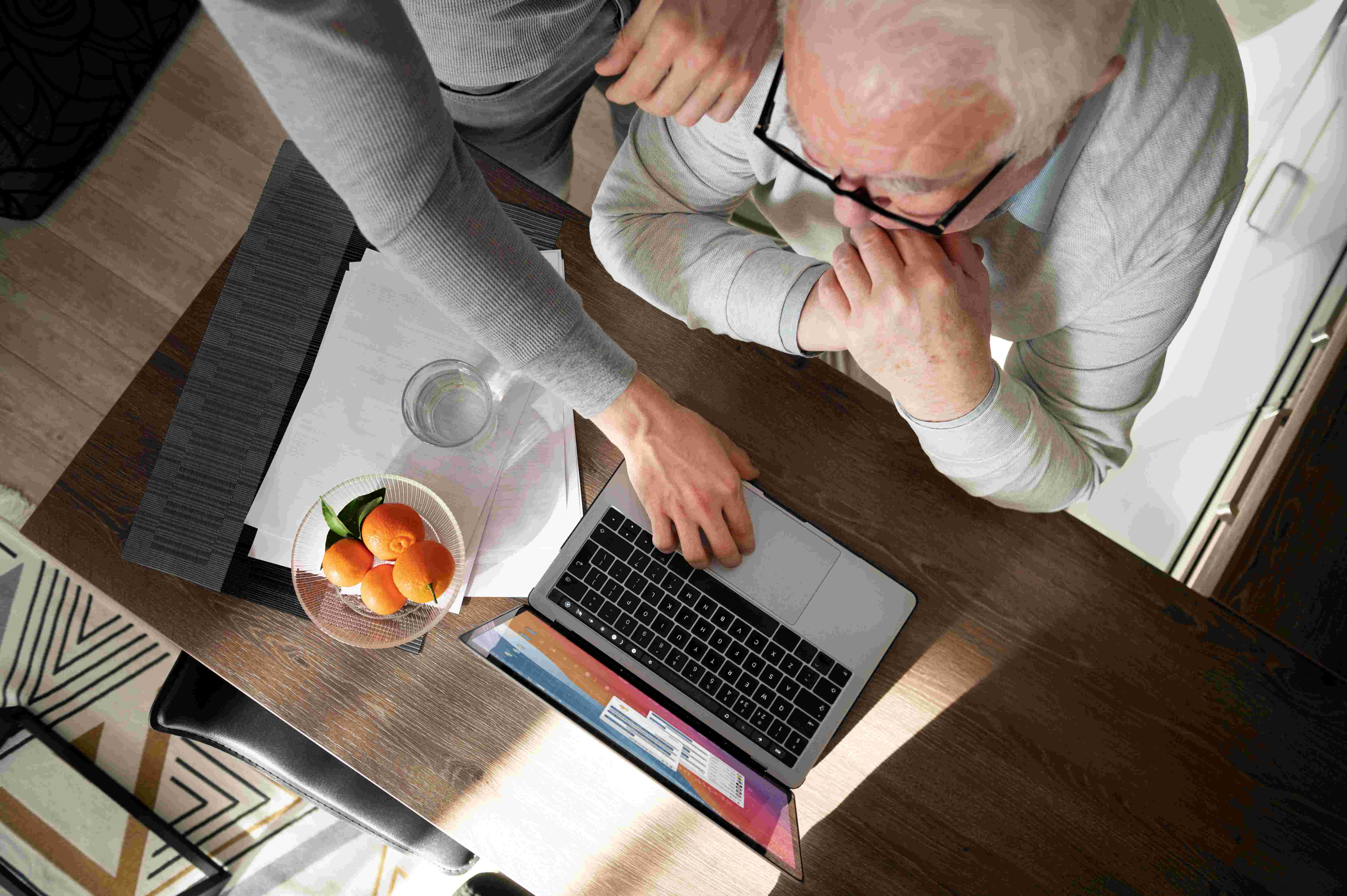 elderly person comforted by helping hand
